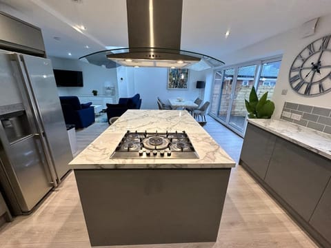 Kitchen or kitchenette, dishwasher, oven, stove