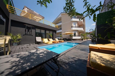 Property building, Patio, Day, View (from property/room), Balcony/Terrace, Pool view, Swimming pool, sunbed