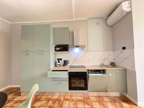 Kitchen or kitchenette, dishwasher, oven, stove, toaster