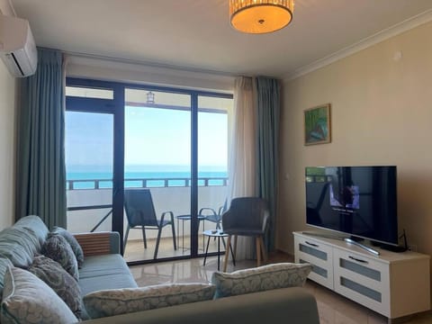 TV and multimedia, Living room, Seating area, Sea view, air conditioner