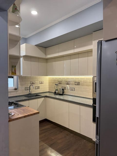 Kitchen or kitchenette, dishwasher, oven, stove