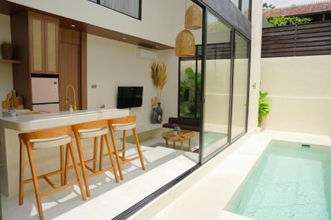 Property building, Living room, Seating area, Dining area, Pool view, Swimming pool