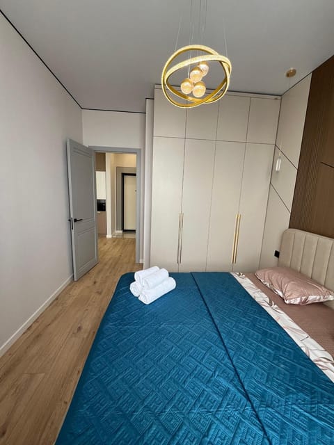 Bed, towels, wardrobe