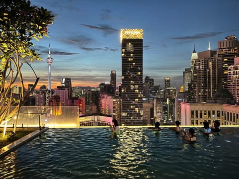Property building, Nearby landmark, Night, People, Natural landscape, City view, Pool view, Swimming pool, group of guests