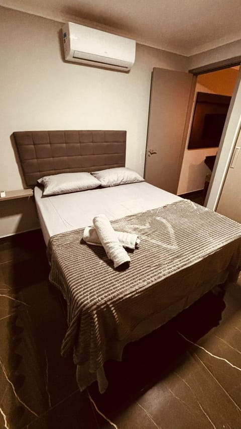 Bed, Photo of the whole room, Bedroom, towels, air conditioner