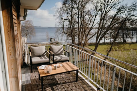 View (from property/room), Balcony/Terrace, Seating area, Dining area, Lake view