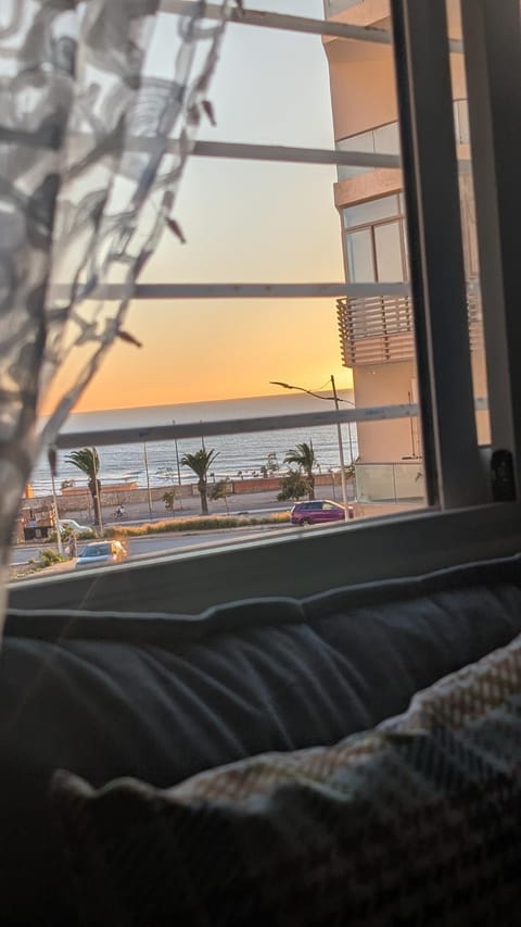 Day, View (from property/room), Living room, Seating area, Sea view, Sunset