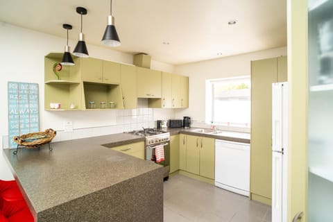 Kitchen or kitchenette, dishwasher, oven, stove