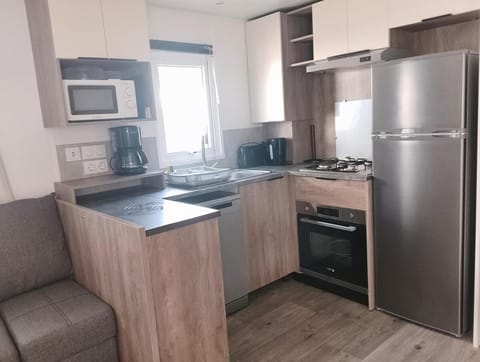 Kitchen or kitchenette, dishwasher, oven, stove, toaster