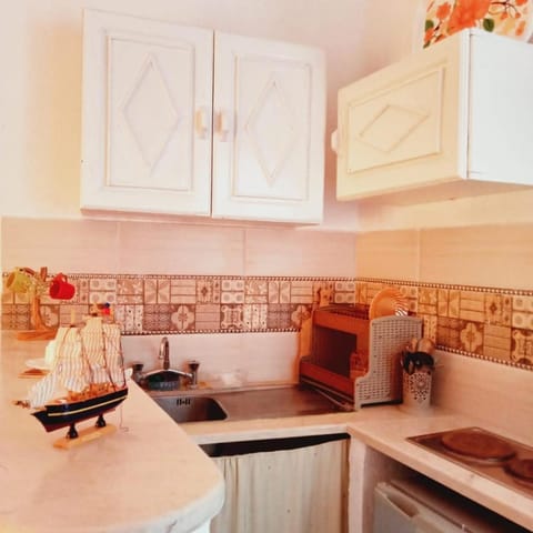Kitchen or kitchenette, stove