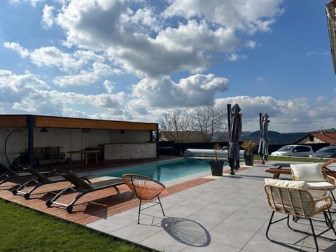 Property building, Patio, Pool view, Swimming pool, sunbed