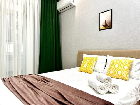 Bed, Photo of the whole room, Bedroom, towels, air conditioner