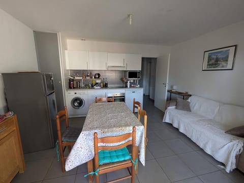 Living room, Dining area, oven, stove, toaster