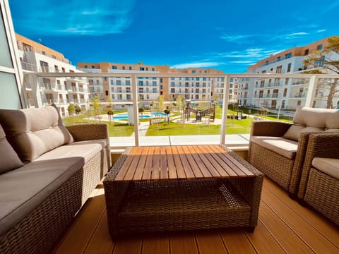 Property building, Patio, Day, View (from property/room), Balcony/Terrace, Seating area, Pool view, Swimming pool