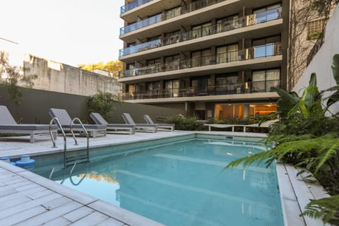 Property building, Patio, Day, Pool view, Swimming pool, sunbed