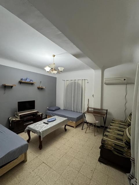 Bed, TV and multimedia, Living room, Seating area
