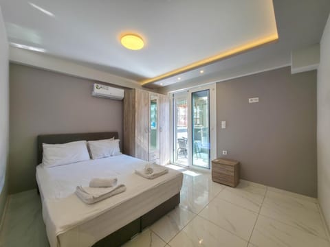 Bed, Photo of the whole room, Bedroom, towels, air conditioner