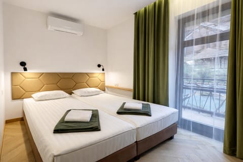 Bed, Photo of the whole room, Bedroom, towels, air conditioner