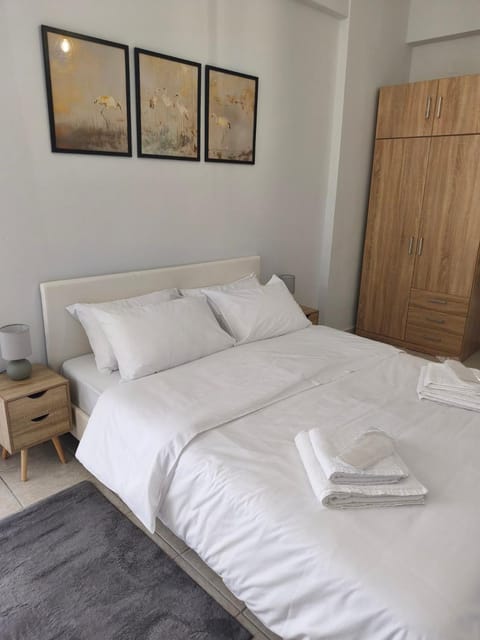 Bed, towels, wardrobe