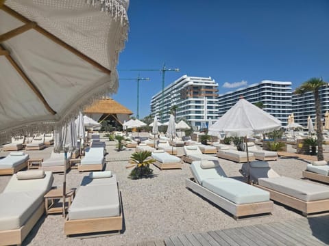 Property building, Day, Living room, Seating area, Beach, sunbed