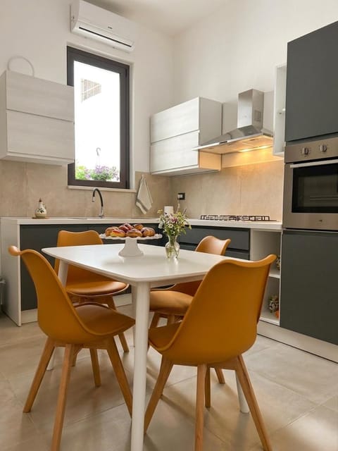 Kitchen or kitchenette, Seating area, Dining area, oven, stove, air conditioner