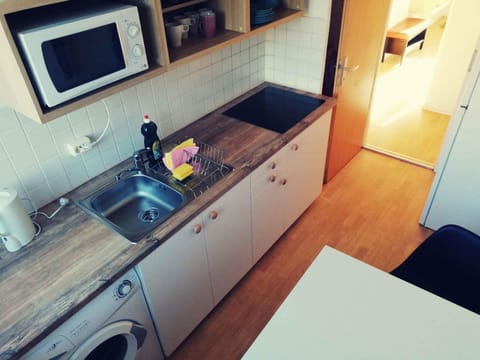Kitchen or kitchenette, washing machine