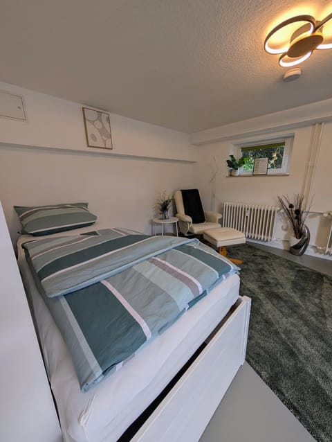 Bed, Living room, Seating area, Bedroom