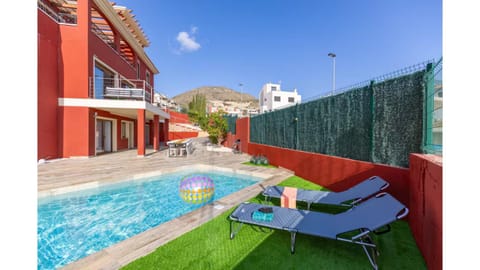 Property building, Patio, Pool view, Swimming pool, sunbed