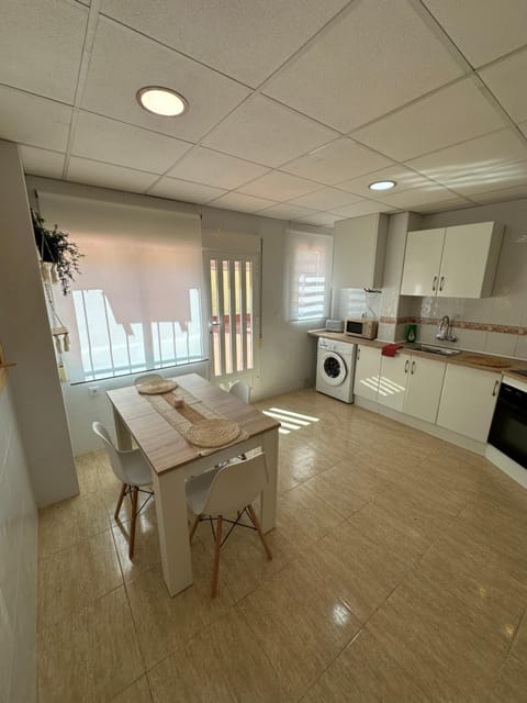 Dining area, stove, washing machine