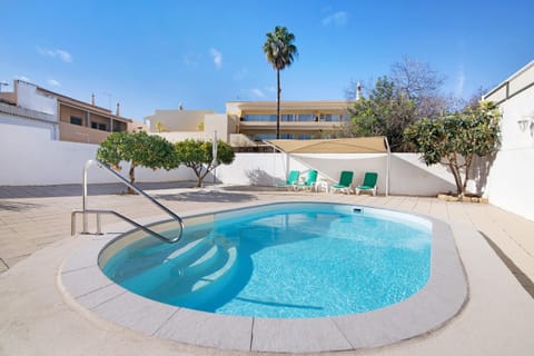 Property building, Living room, Swimming pool