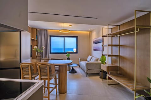 View (from property/room), Kitchen or kitchenette, Living room, Seating area, Dining area, Sea view