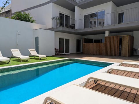Property building, Pool view, Swimming pool, sunbed