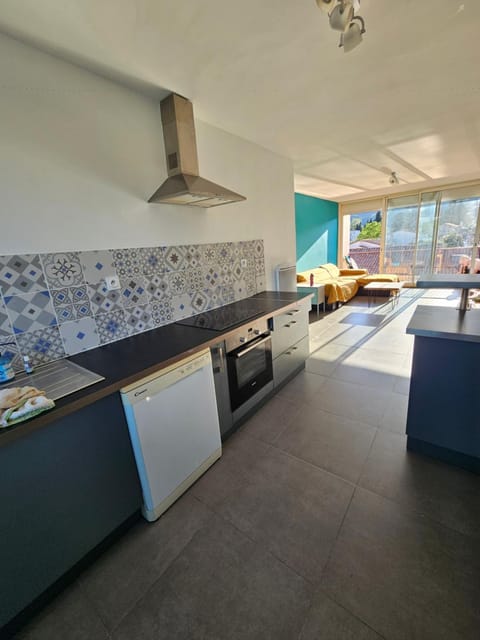 Kitchen or kitchenette, dishwasher, oven, stove