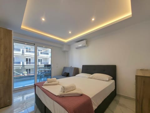 Bed, Photo of the whole room, Bedroom, towels, air conditioner