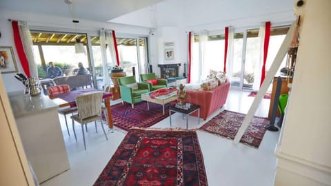 Living room, Seating area, Dining area, fireplace, fireplace, air conditioner
