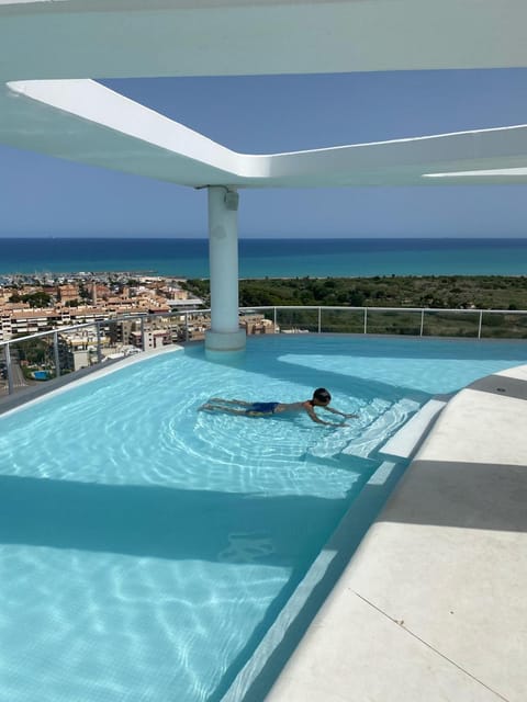 Balcony/Terrace, Seating area, City view, Sea view, Swimming pool, Time of day