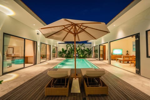 Patio, Night, Pool view, Swimming pool, sunbed