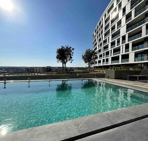 Property building, Pool view, Swimming pool, sunbed