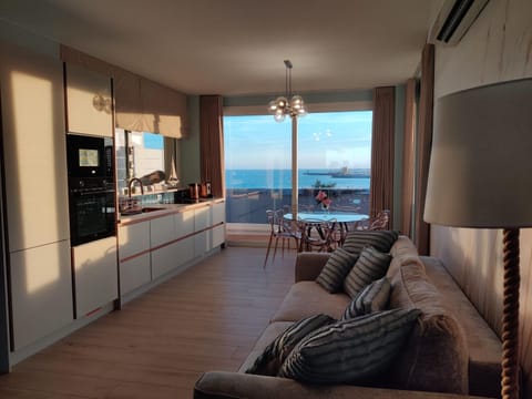 Kitchen or kitchenette, Living room, Seating area, Dining area, Sea view