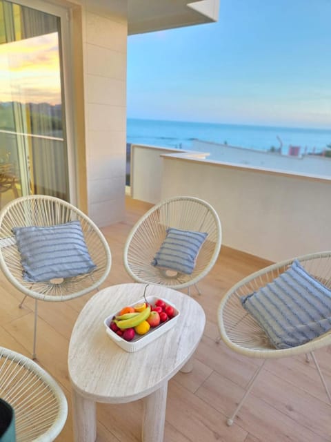 View (from property/room), Balcony/Terrace, Seating area, Beach, Sea view