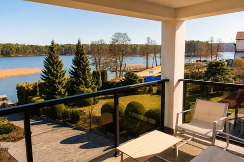 Property building, Patio, Day, Natural landscape, View (from property/room), Balcony/Terrace, Seating area, Lake view