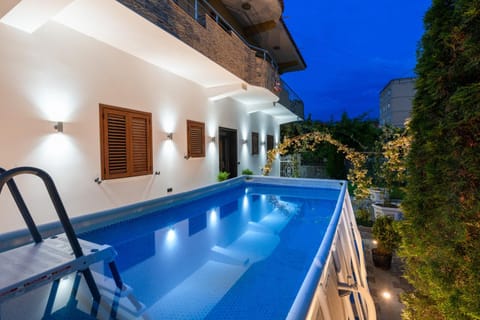Patio, Night, Pool view, Swimming pool, sunbed