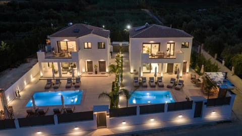 Property building, Patio, Night, Pool view, Swimming pool, sunbed
