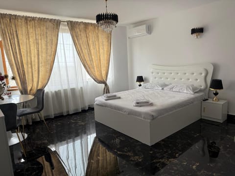Property building, Bed, Seating area, Bedroom, towels, air conditioner