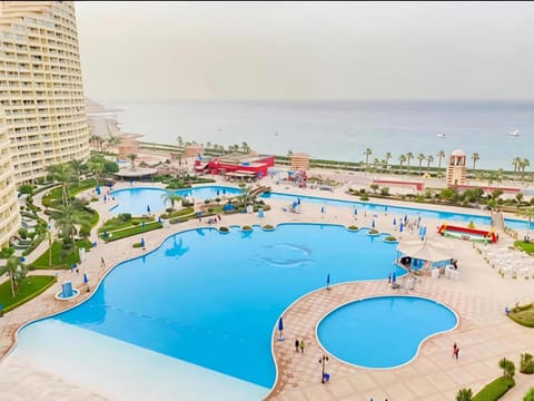 Nearby landmark, Communal lounge/ TV room, Day, Natural landscape, Bird's eye view, Beach, Evening entertainment, Pool view, Sea view, Swimming pool, sunbed