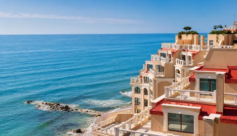 Property building, Nearby landmark, Day, Natural landscape, View (from property/room), Balcony/Terrace, Beach, City view, Sea view