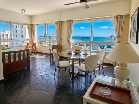 View (from property/room), Living room, Seating area, Dining area, Sea view