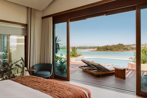 Patio, Bed, Day, Natural landscape, Balcony/Terrace, Bedroom, Pool view, Swimming pool, sunbed