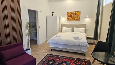 Bed, Living room, Seating area, Bedroom, towels