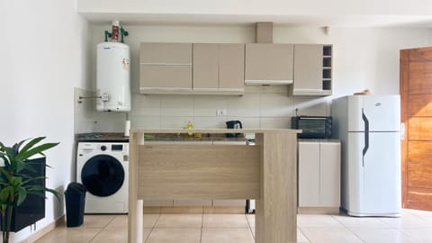 Kitchen or kitchenette, oven, washing machine